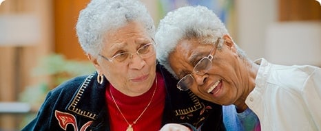 Two seniors laughing