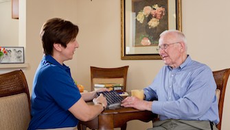 resident speaking with his nurse