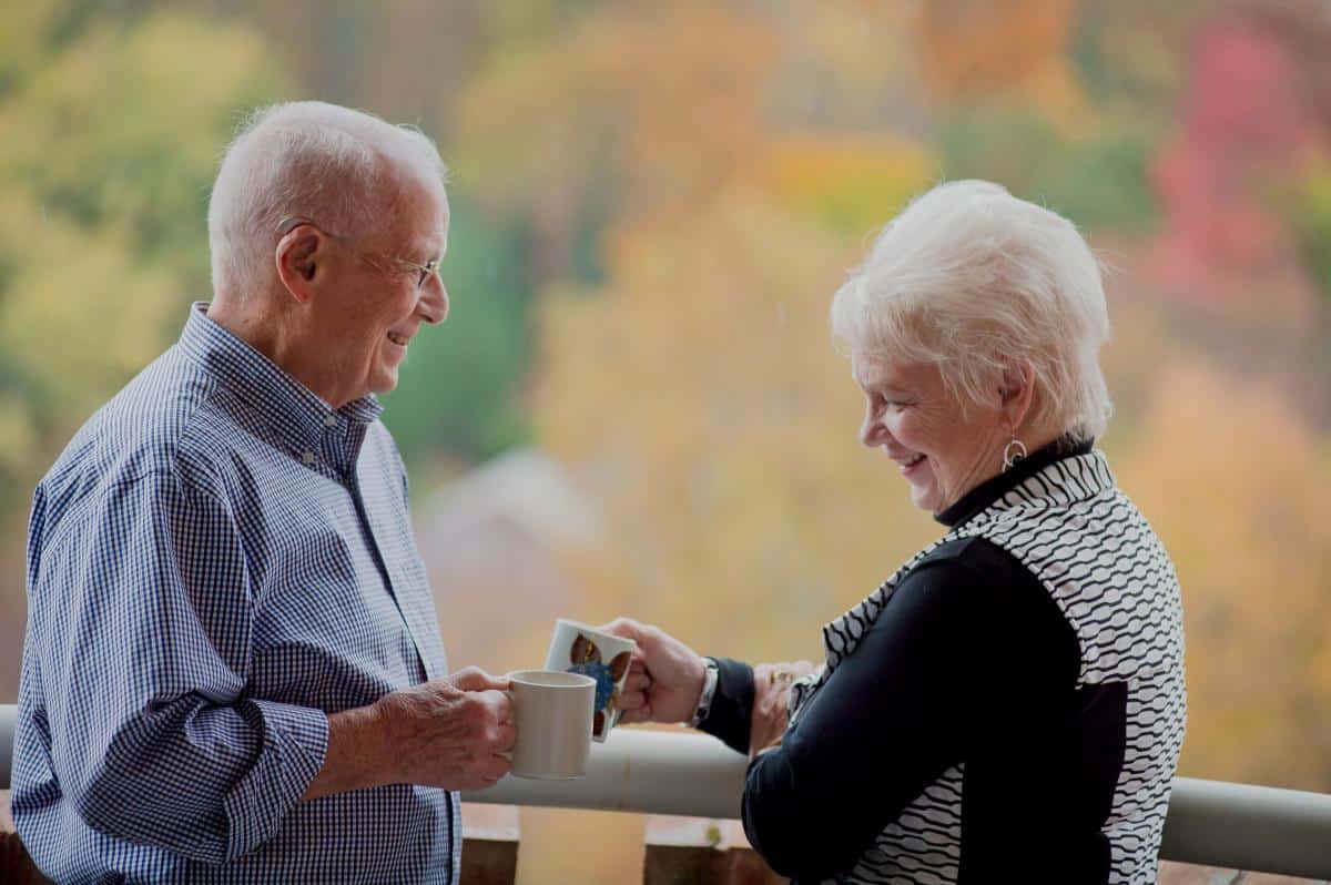Residents sharing coffee on the patio