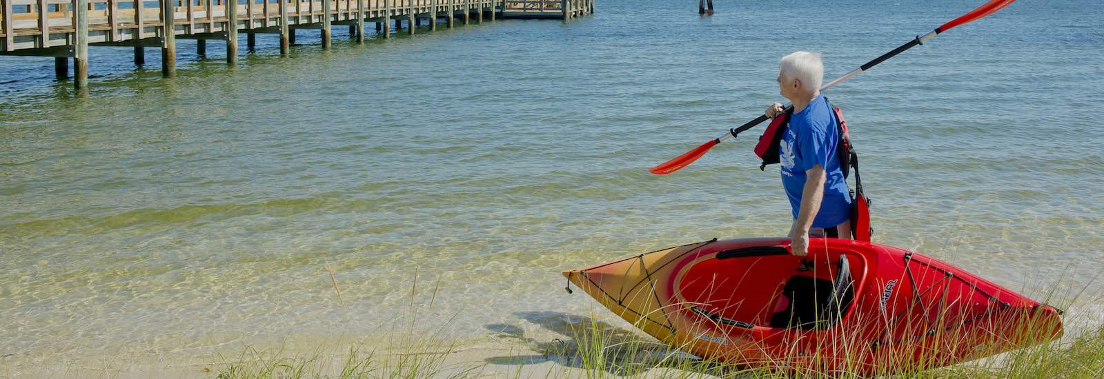 resident with a kayak along the water