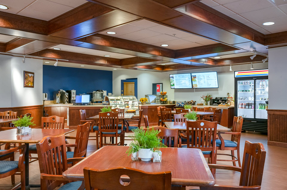 tables and deli counter and cases at bethany village collegiate cafe