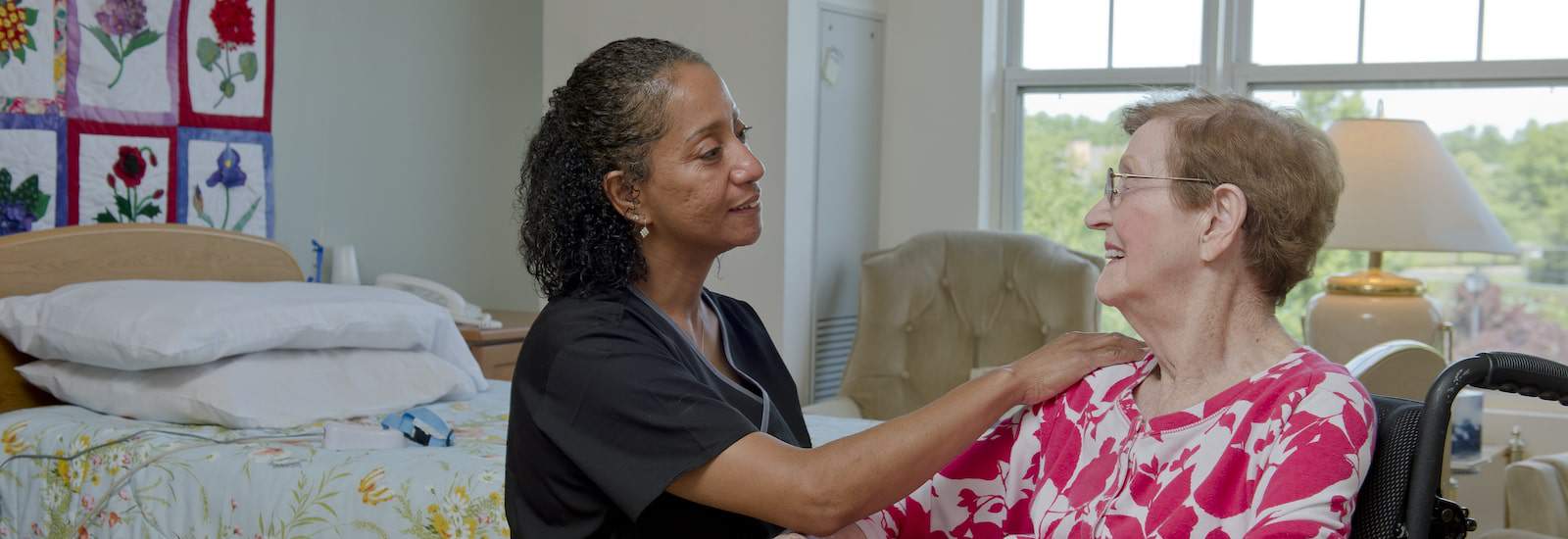 skilled nurse talking with resident