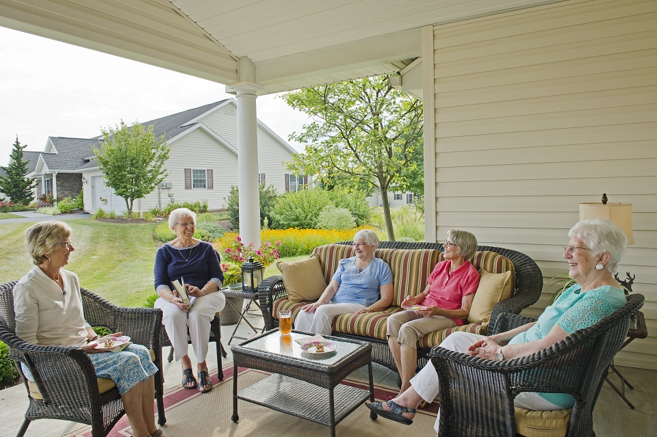 residents sitting on porch