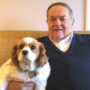 Springhill resident Bob and his King Charles Spaniel Molly, sitting together on a couch