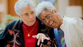 elderly couple laughing