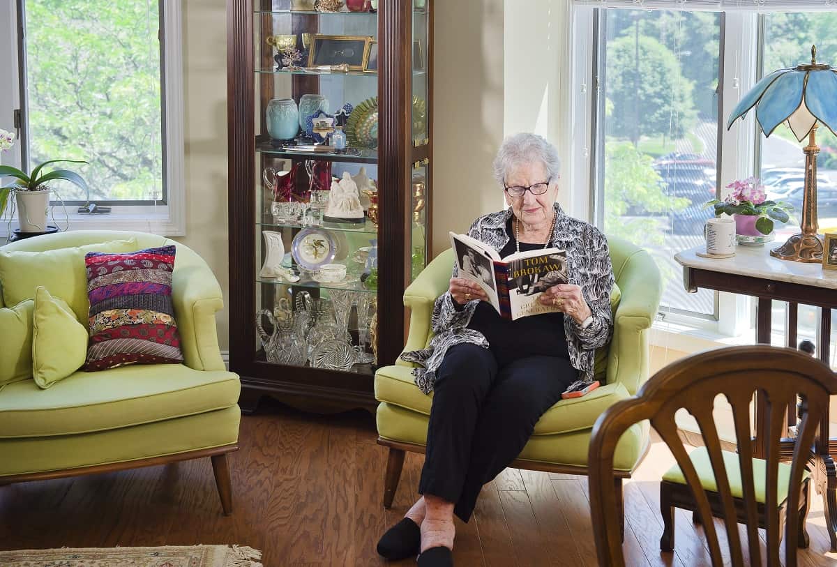 resident reading at Kingsport senior apartments