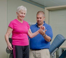 therapist helping patient