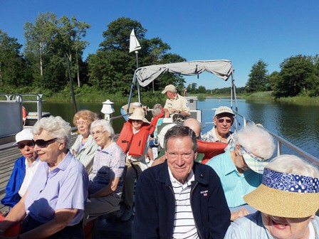 residents enjoying a pontoon boat tour