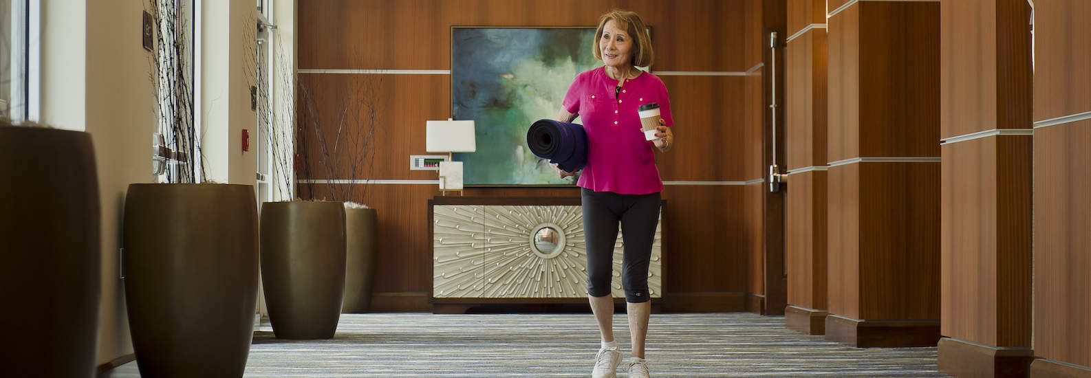 resident walking down hallway