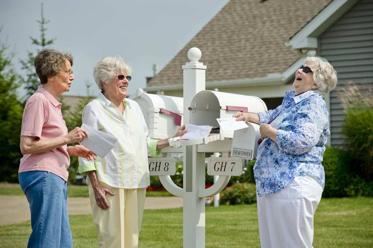 residents chatting at the mail box