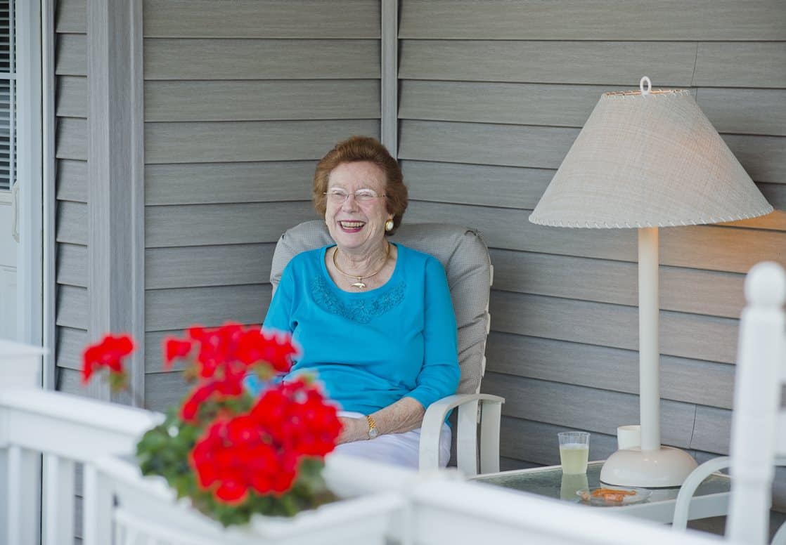 resident enjoying her front porch