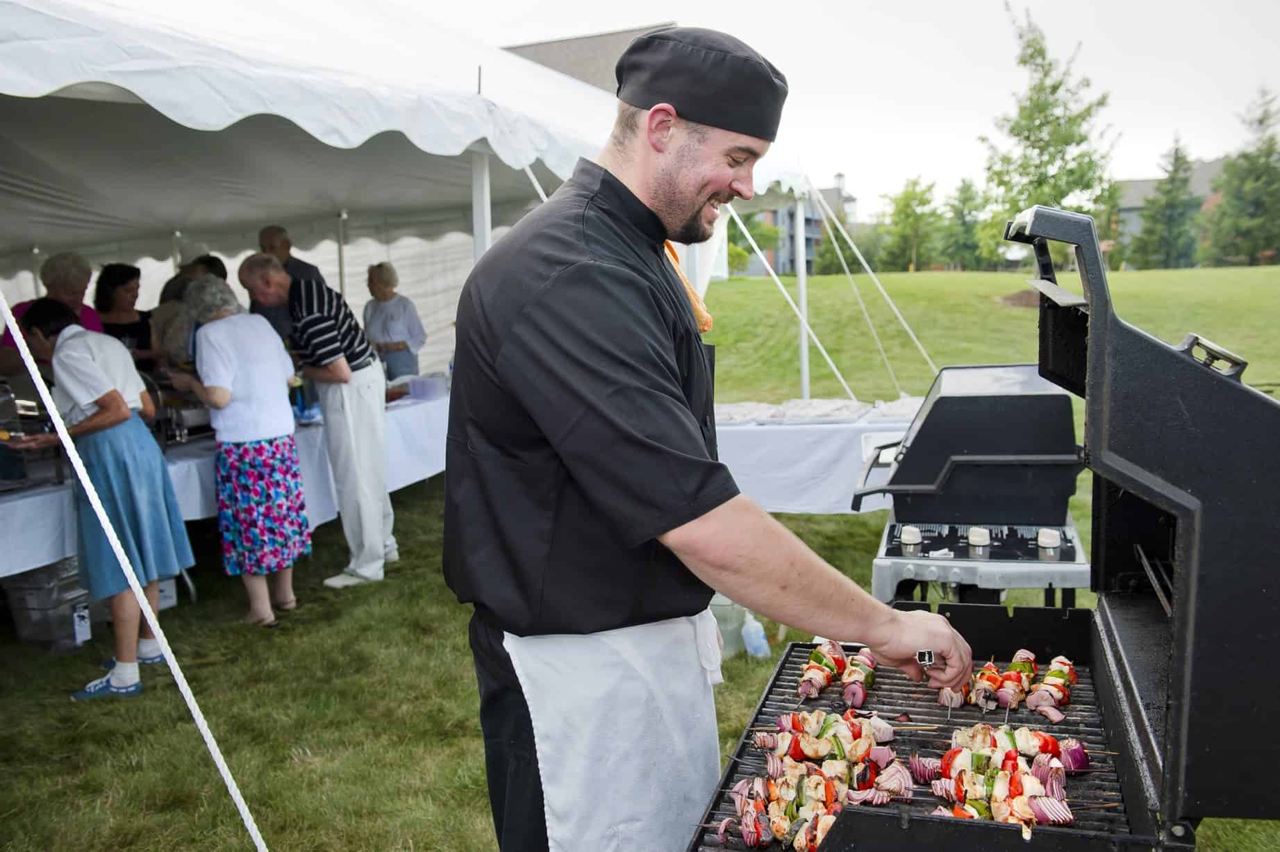 staff hosting outdoor party for residents