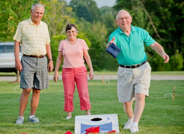 residents playing cornhole