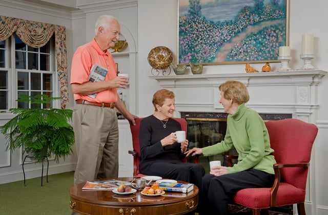 residents laughing together in the lounge area