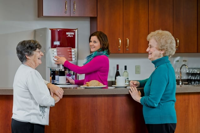 staff member hosting happy hour with residents