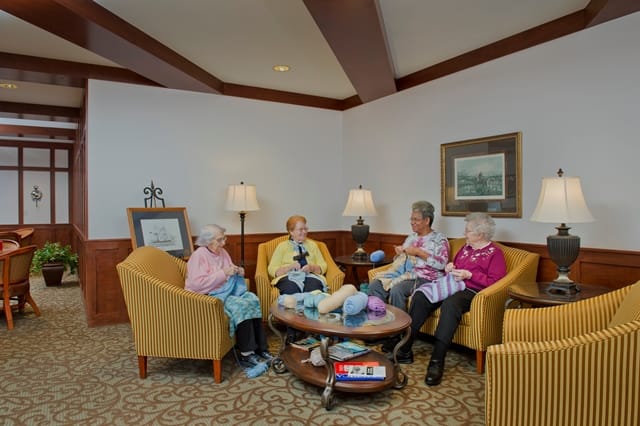 ladies chatting and crocheting together