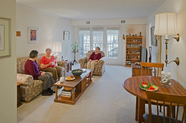 residents chatting together in apartment