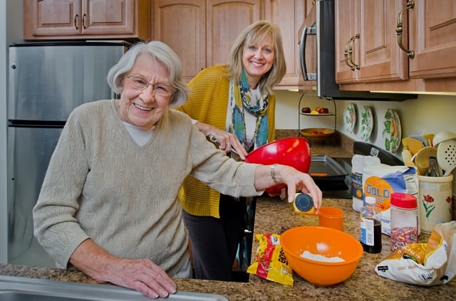 volunteer assisting resident in cooking