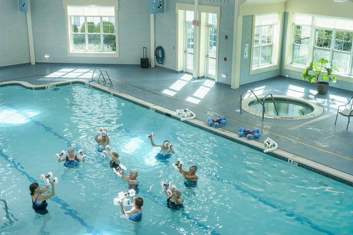 group of seniors in pool doing water aerobics