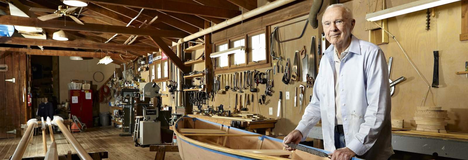 gentleman volunteer woodworking on a boat