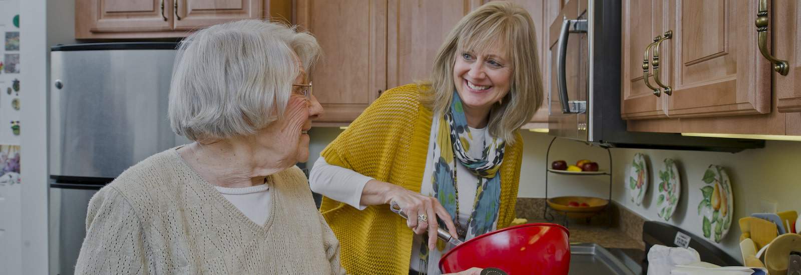 volunteer assisting resident with cooking