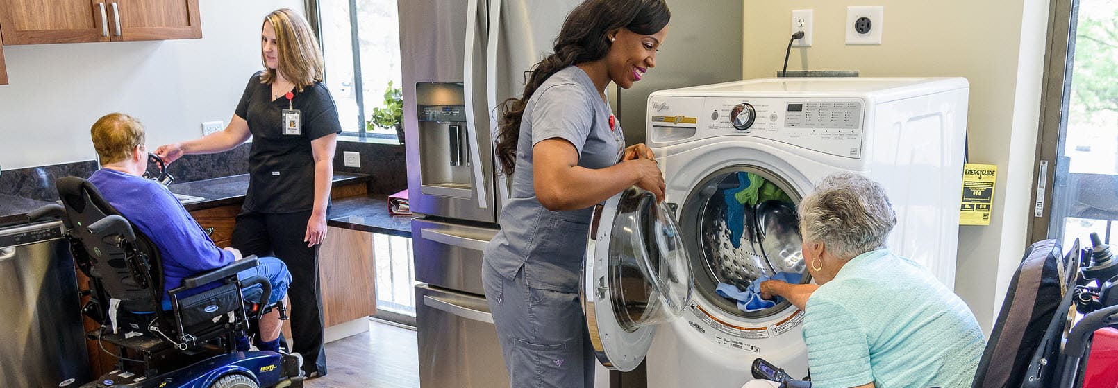 assisted living staff and nurses helping residents with laundry and cleaning