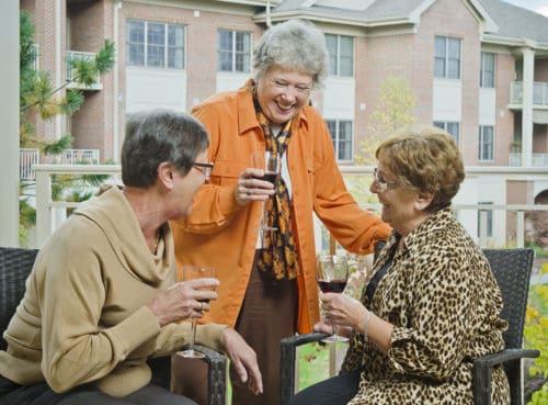 residents enjoying drinks on the patio