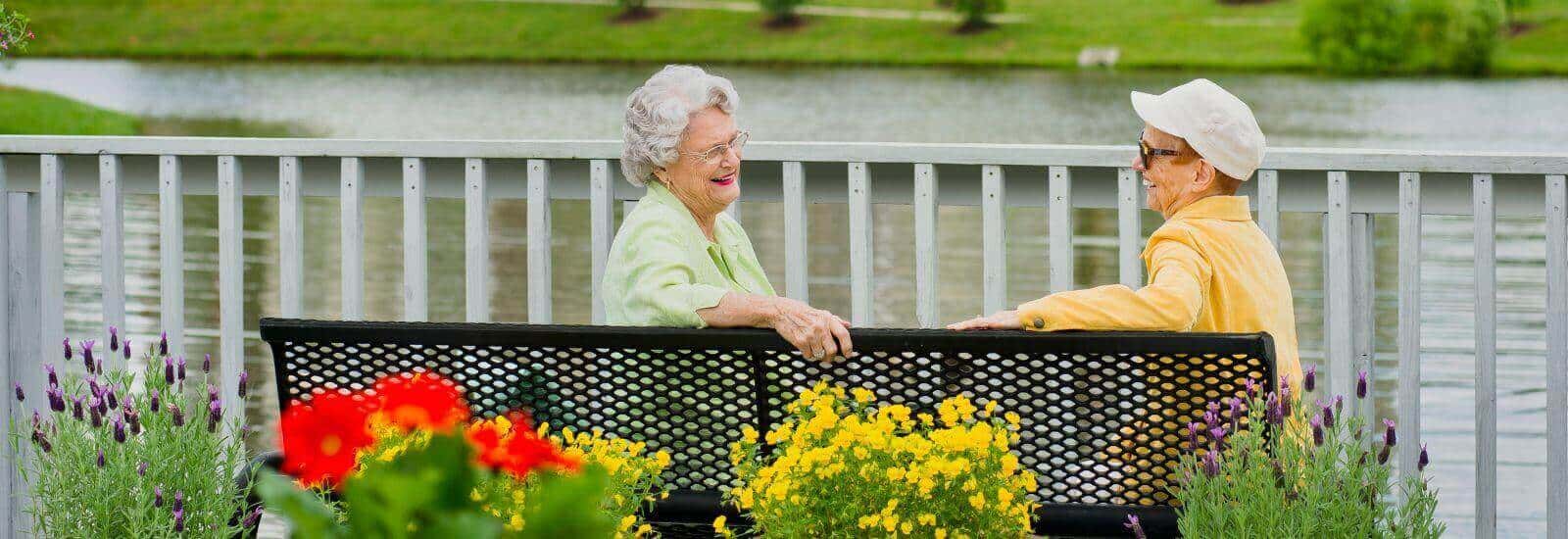 residents sitting by the river at Asbury Place Maryville