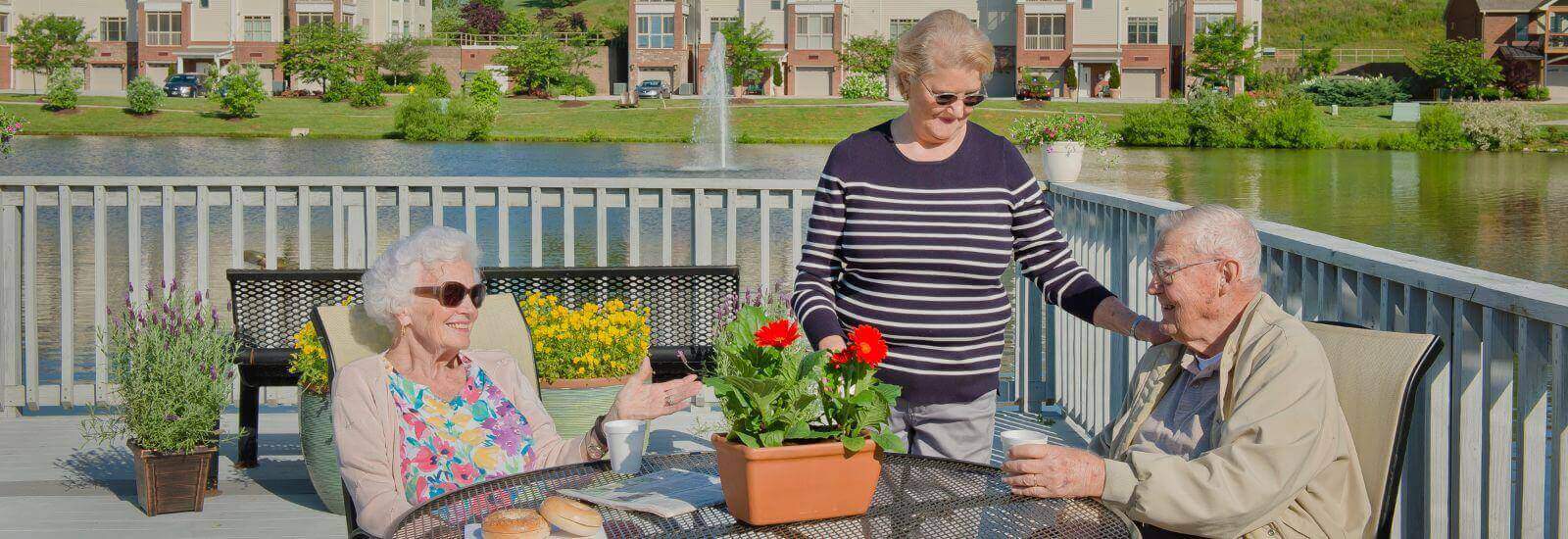 residents enjoying coffee on the patio at Asbury Place Maryville