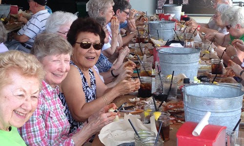 residents enjoying a crab feast