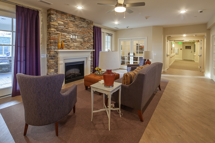 fireplace lounge at alpine memory care at asbury place maryville