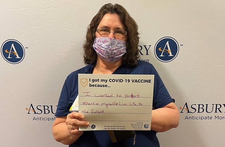 senior living healthcare worker receives COVID-19 vaccine at Asbury