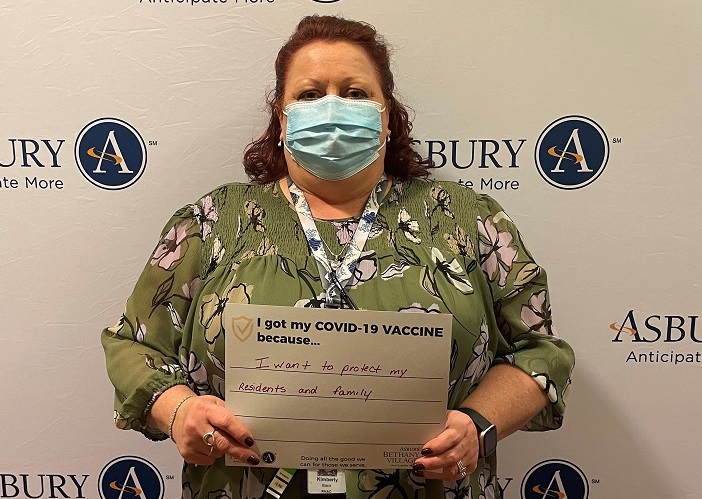 senior living healthcare worker receives COVID-19 vaccine at Asbury