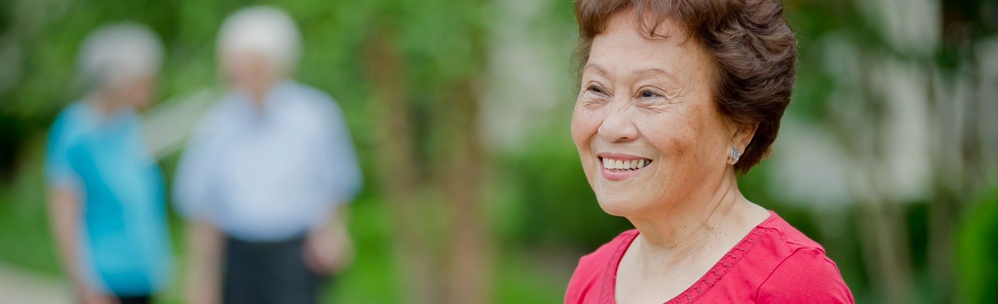 smiling resident outdoors at Asbury