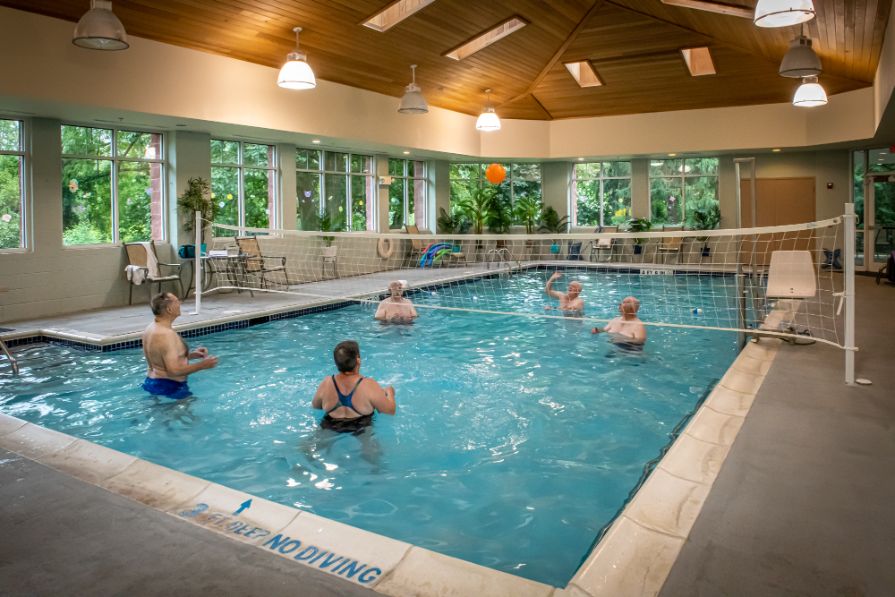 residents enjoying the indoor pool at riverwoods