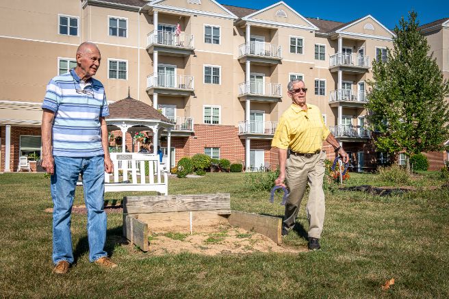 residents playing horseshoes at normandie ridge