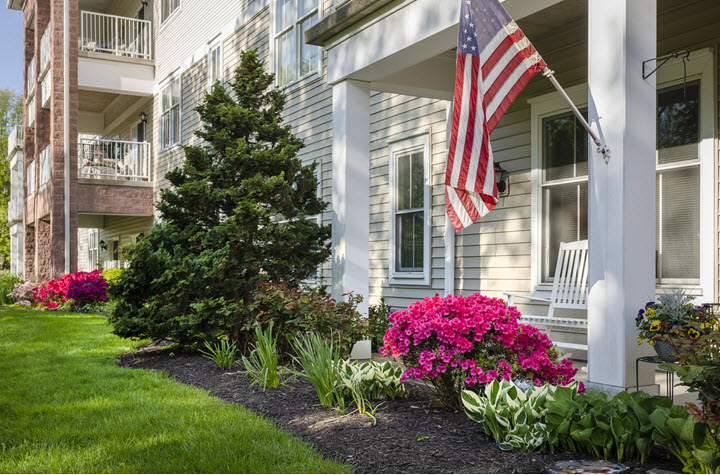 american flag outside of a residents apartment