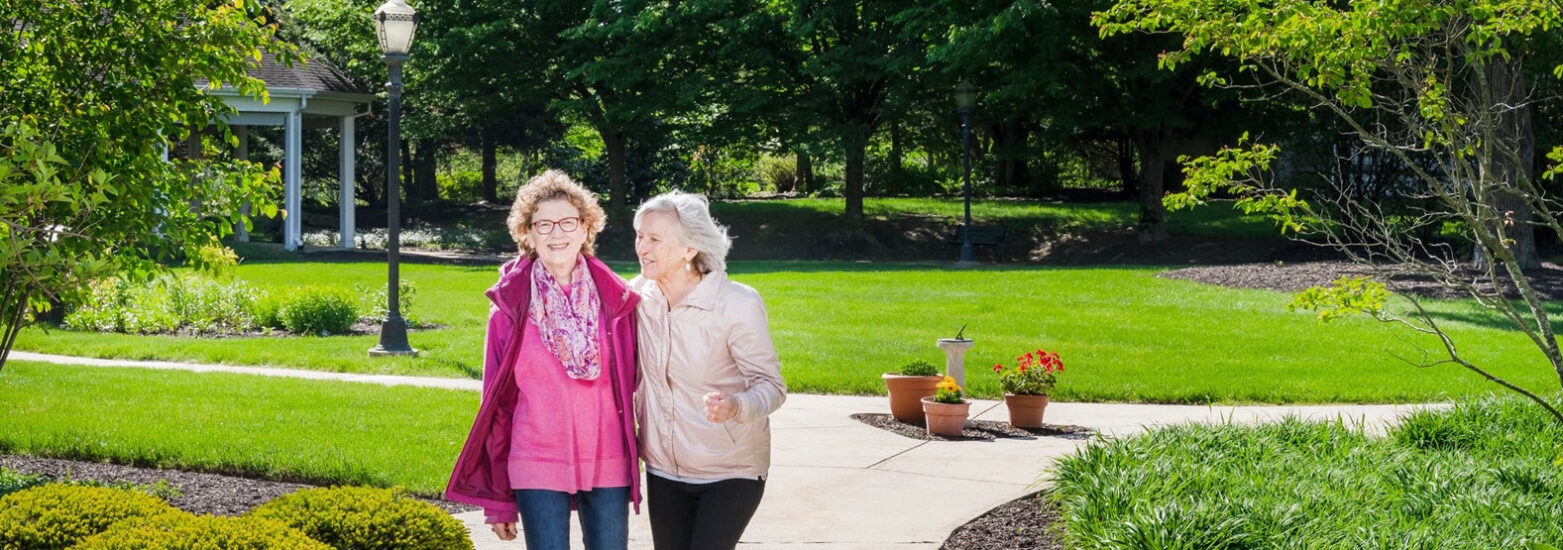residents enjoying a walk around riverwoods campus partaking in active aging Lewisburg