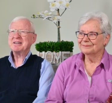 an older couple sitting together