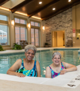 two Springhill residents stand in the aquatic center pool