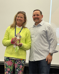 Kelly Friedman and Doug Leidig with Edwin C Thomas award trophy