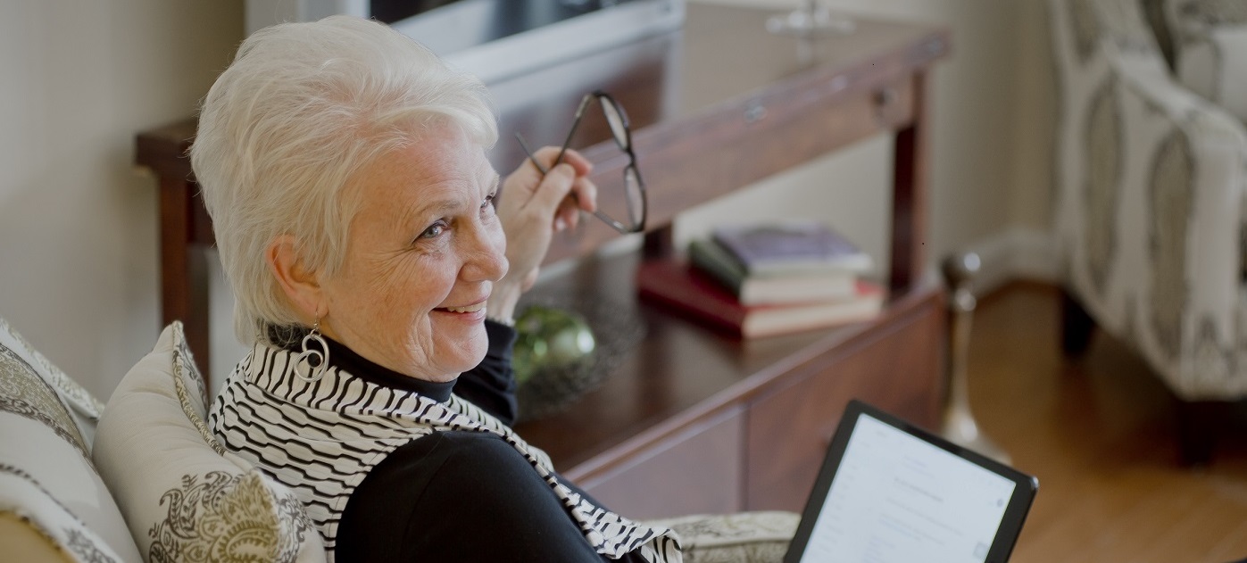 Smiling female resident with her ipad