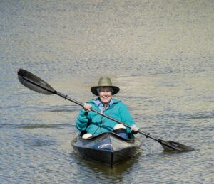 Senior in a kayak on a lake