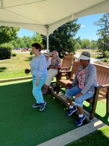 Female residents playing bocce ball