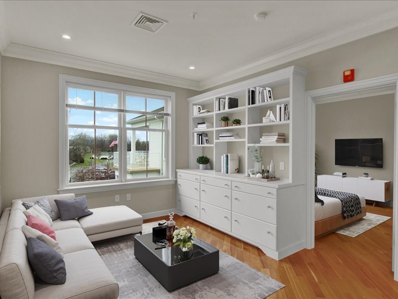 Modern apartment with white couch and large window