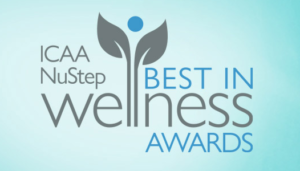 blue background with gray leaves growing up from the word wellness with ICAA NuStep Best in WEllness Awards logo
