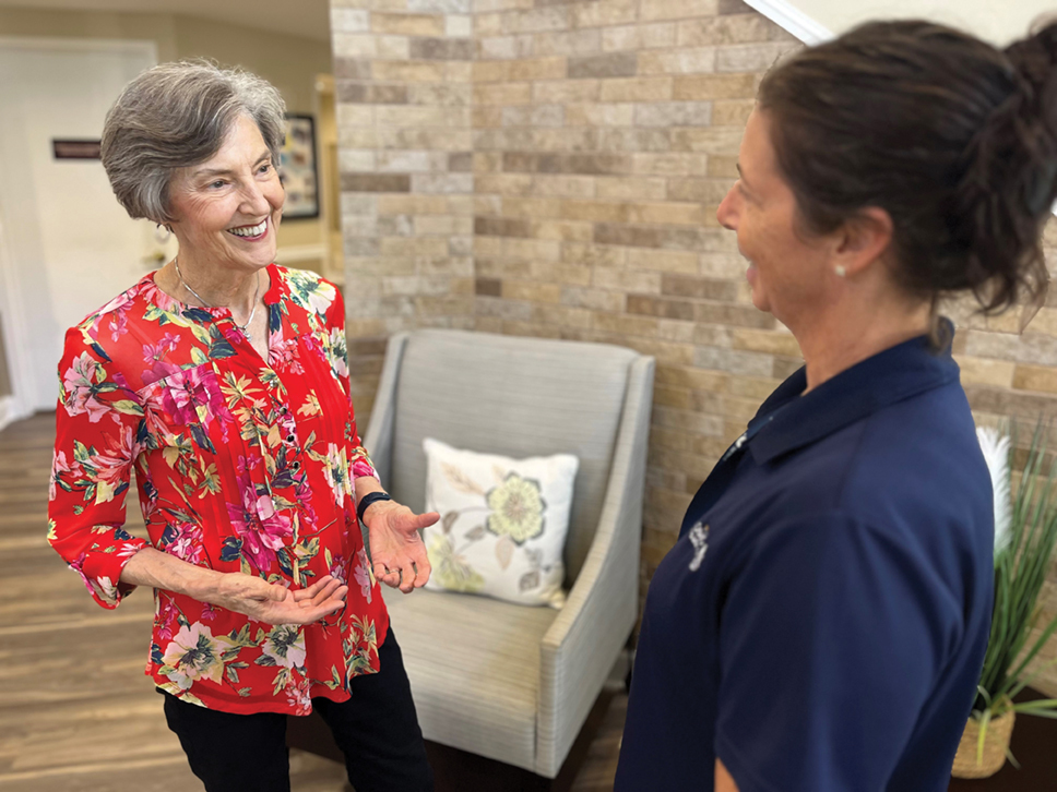 Susan Martin having a discussion with a team member